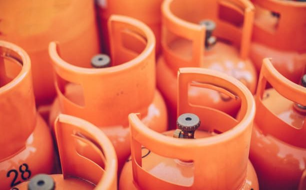 Group of orange LPG tanks, no people.